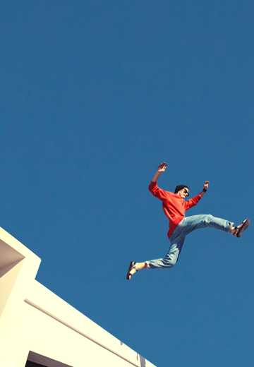 A man jumping from a building