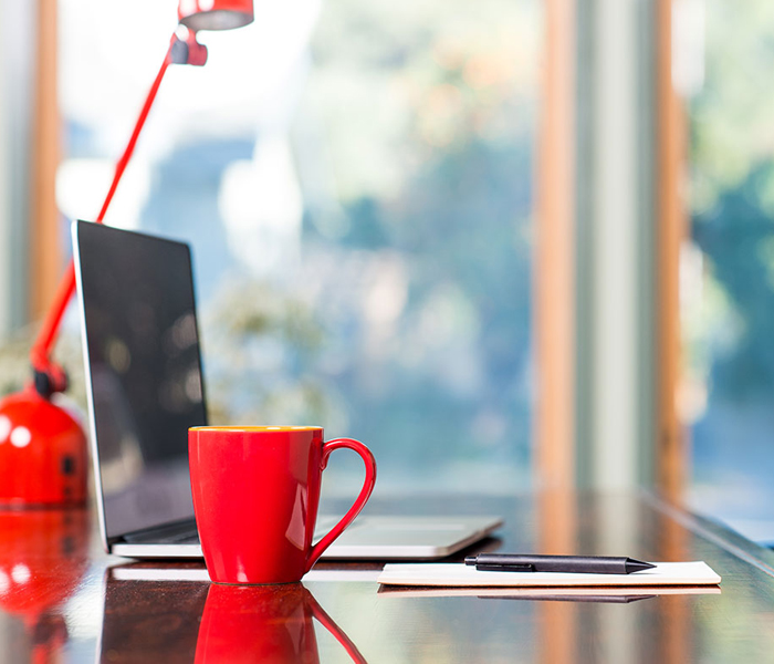 Laptop and mug on a desk
